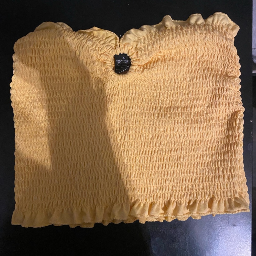 yellow tube crop top with ring on chest for design